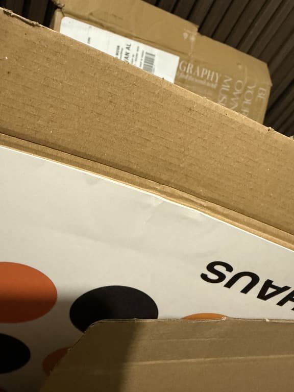 paid for hone delivered and it got taken to a local corner shop! there were creases on the picture when it arrived.